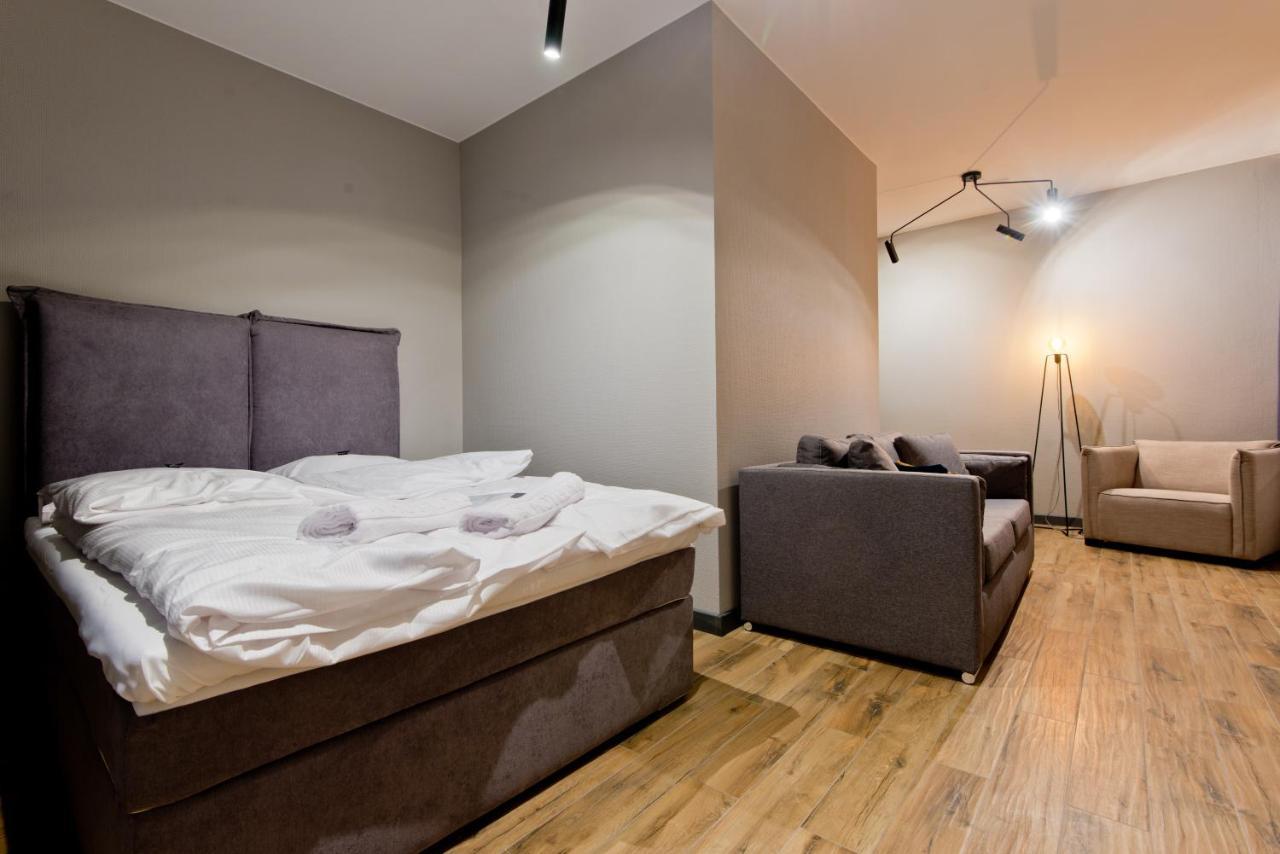 Apartsuites I Sorau Zary  Exterior photo A bedroom with a sofa bed